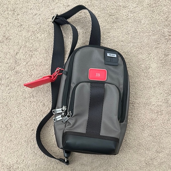 TUMI Fife Slim Sling Bag With Adjustable Strap (personalized “JB”)